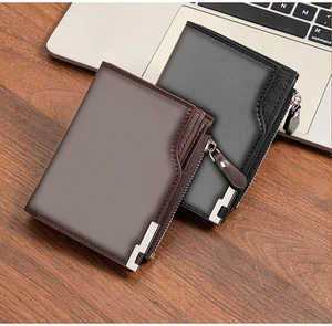 Detailed view of two men's leather wallets with zipper pockets on a wooden desk