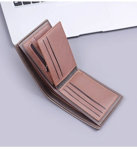 Detail view of brown leather wallet interior featuring multiple card slots and zip pocket