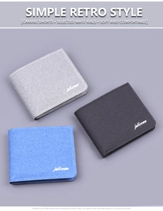 Detailed close-up of three slim canvas bi-fold wallets in grey, black, and blue colors