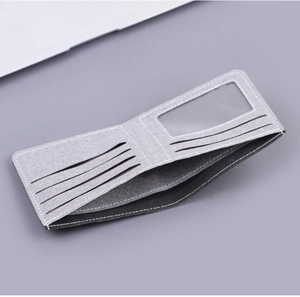 Detailed view of gray canvas wallet interior with multiple card slots and transparent ID window