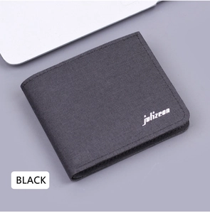 Close-up of the woven canvas texture and brand logo on this slim bi-fold men's wallet