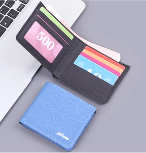 Detail view of canvas wallet interiors with multiple card slots and cash compartments