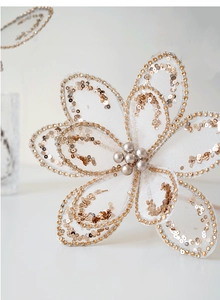 Detail of champagne glitter mesh Christmas flower with silver pearls for tree decor