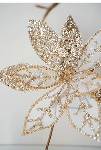 Macro shot of champagne gold mesh Christmas flower with sequins and bead details