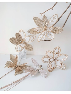 Detailed view of champagne mesh Christmas flower picks with glitter birds and feathers