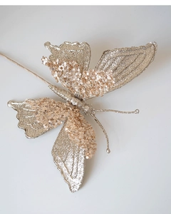 Detail of champagne gold butterfly ornament with glitter texture for Christmas tree decor
