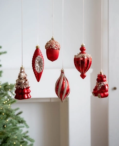 Detailed view of 6-piece red and champagne glitter Christmas ornaments with bear and acorn