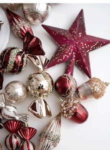 Detailed Christmas ornaments in burgundy and champagne gold with glitter and matte finishes
