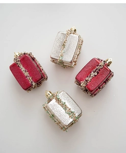 Detail of red and champagne gift box ornaments with sequins and beaded ribbons