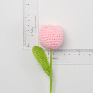 Macro shot of handmade crochet pink tulip showing 4cm head size with measurement ruler