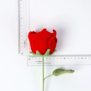 Handmade red crochet Thai rose with long green stem and leaves measuring 6.5cm wide