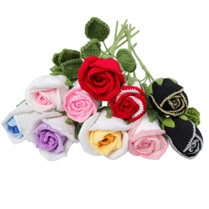 Handmade crochet roses set in various colors with green leaves on white background