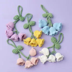 Detailed close-up showing texture of handmade crochet lily of the valley floral charms