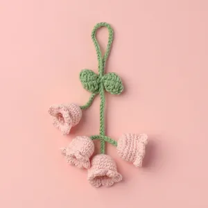 Handmade pink crochet lily of the valley flower keychain with green leaves