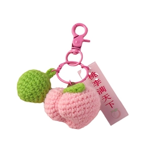 Pink handmade crochet peach keychain with Teacher gift card on white background