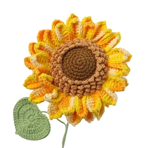Handmade crochet sunflower with multi-tone petals and green leaves for home decoration