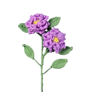 Handmade crochet bouquet with purple flowers, yellow stamens and green leaves