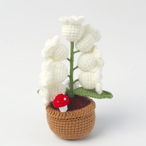 Handmade crochet lily of the valley night light with small mushroom in a knit pot
