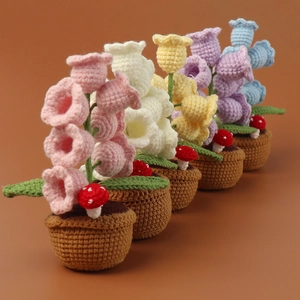 Detailed knit texture of handmade lily of the valley crochet potted flowers in five colors