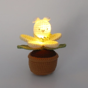 Handmade crochet bunny flower pot night light with warm LED glow and knit textures