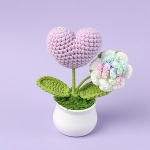 Detailed handmade crochet lavender heart and rainbow rose flower in a white pot