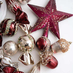 Champagne and burgundy Christmas ornament set with candy, star, and bauble shapes