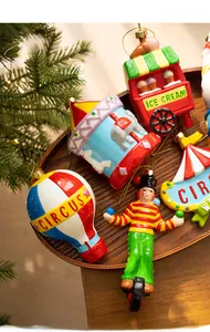 Detailed view of colorful circus-themed Christmas tree ornaments with carousel and hot air balloon