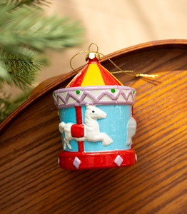 Close-up of a carousel horse ornament with festive colors on a warm wooden background