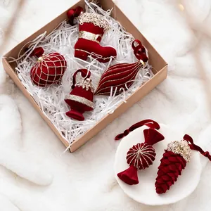Velvet burgundy Christmas ornaments set with gold glitter in a festive holiday gift box