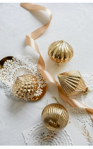 Set of 4 gold glass ornaments in pumpkin and geometric shapes for Christmas tree decor