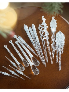 Macro detail of transparent acrylic icicle ornaments with sparkling white glitter textures