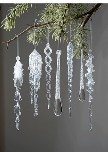 Detailed view of clear acrylic icicle ornaments with glitter for Christmas tree decor