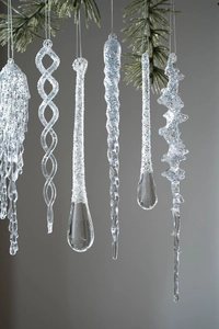 Close-up of clear acrylic icicle ornaments with glitter finish for Christmas trees