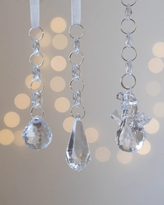 Macro detail of acrylic snowflake pendants with crystal beads for Christmas tree decor
