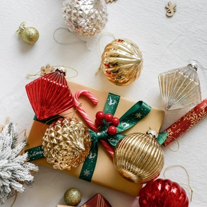 Assorted Christmas glass ball ornaments in red, gold, and silver for tree decoration
