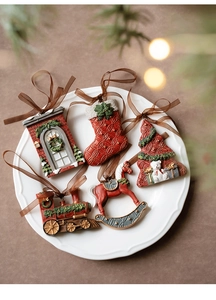 Detailed view of 5-piece resin Christmas tree ornaments with festive embossed textures