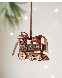 Detailed view of a vintage red resin steam train ornament with festive green wreaths
