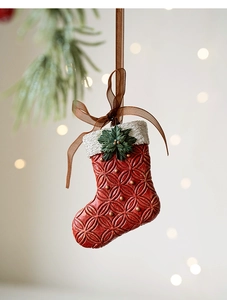 Detailed resin Christmas stocking ornament with textured knit pattern and gold dot accents