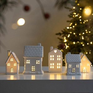Five-piece set of white ceramic glowing houses with gold accents for Christmas decor