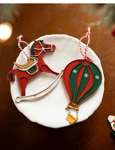 Detail of vintage metal rocking horse and hot air balloon Christmas tree ornaments