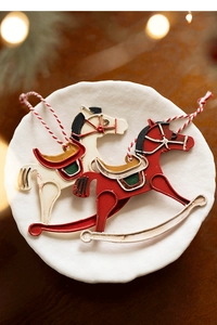 Vintage style metal rocking horse Christmas ornaments with hand-painted rustic finish details