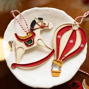 Vintage metal rocking horse and hot air balloon Christmas ornaments with hanging ropes