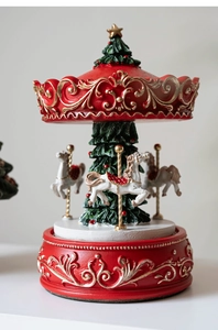 Detailed Christmas carousel featuring white horses and a green tree with gold motifs