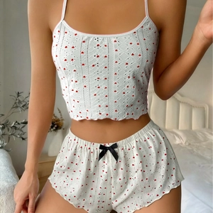 Two-piece ribbed knit pajama set with red heart print and lace details for women
