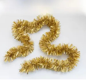 Detail of metallic gold Christmas tinsel garland with shiny rectangular sequins for decor