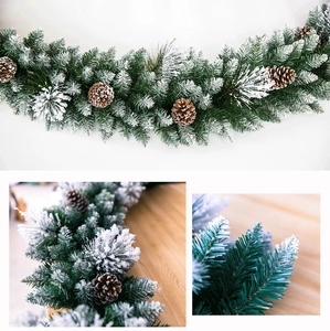 Detail of 2.7m snow-flocked Christmas garland with pine needles and natural pine cones
