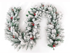 Close-up of 2.7m flocked Christmas garland with red berries and natural pinecones