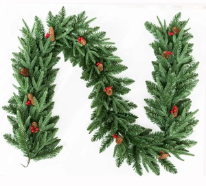 Detail of 2.7m snowy pine garland with natural pine cones and red berries decor
