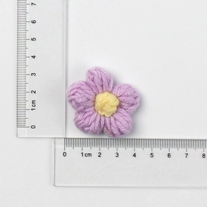 Handmade 4cm macaron crochet flower accessory with purple petals and yellow center