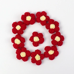 Handmade red and cream crochet puff flowers for DIY hair accessories and clothing decor